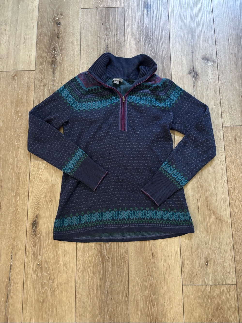 Eddie Bauer half-zip sweater features a blue and purple Fair Isle Nordic pattern